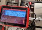 Used ATS Container Fill and Seal Machine (close-up programing screen and label-printing)